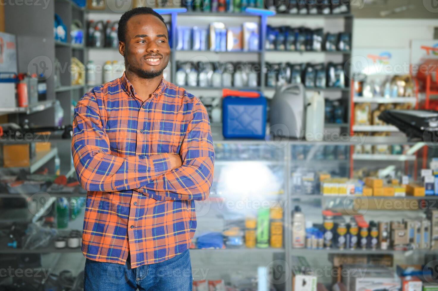 Smiling african Salesman Auto Parts Store photo