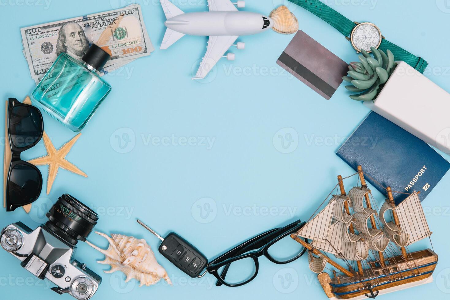 Preparation for Traveling concept, watch, airplane, money, passport, pencils, book, Photo frame, eyeglass on blue background with copy space