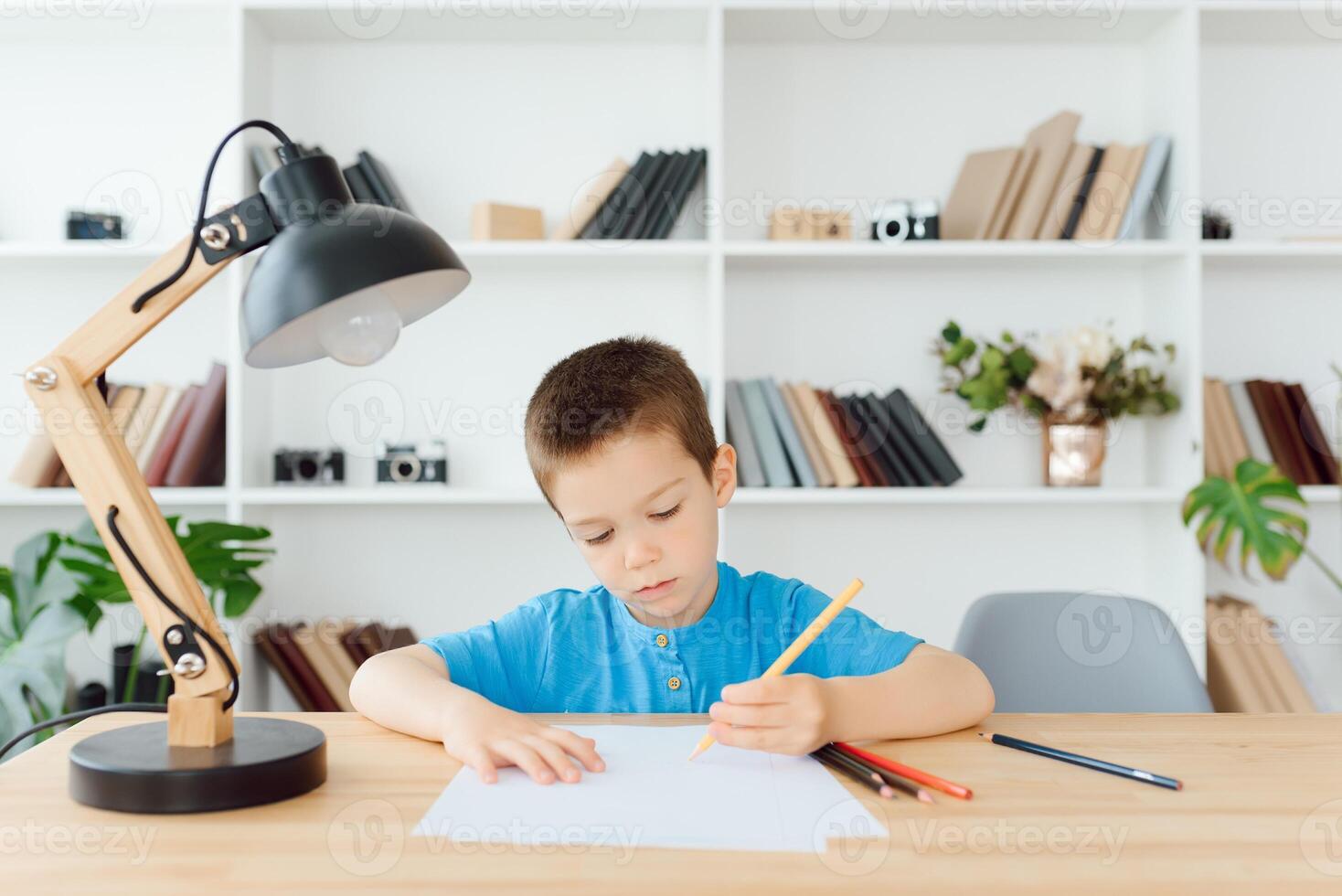 Kid preparing for school at home photo