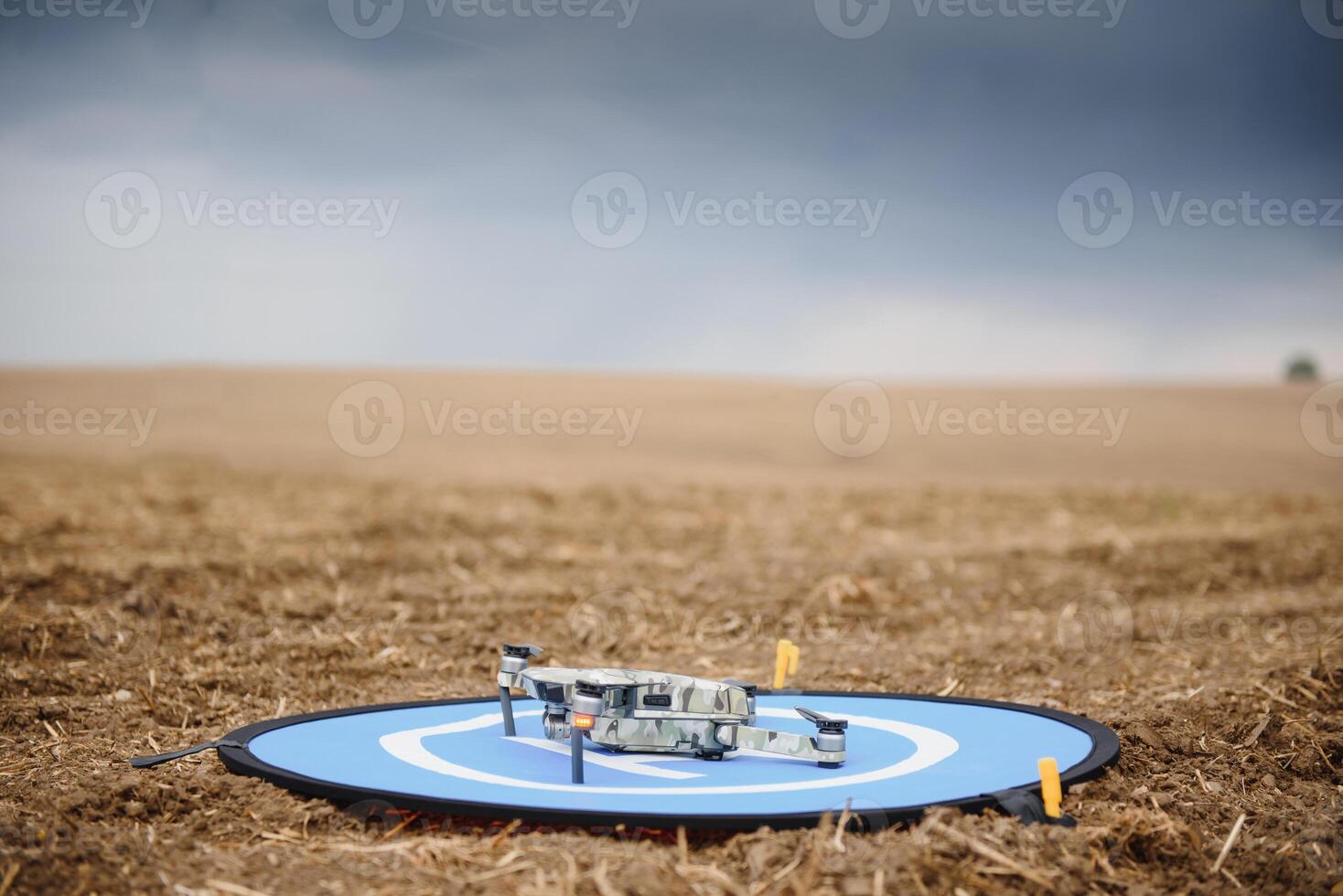 Portable quadcopter against a blue sky with white Cirrus clouds. photo