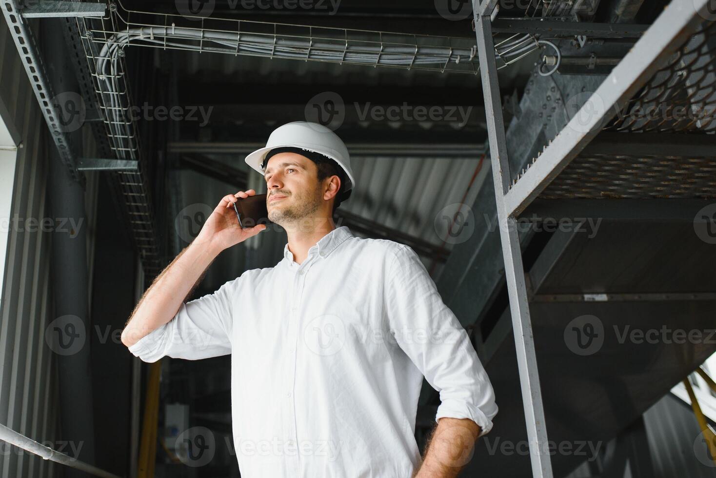 Portrait of an engineer talking on the phone photo