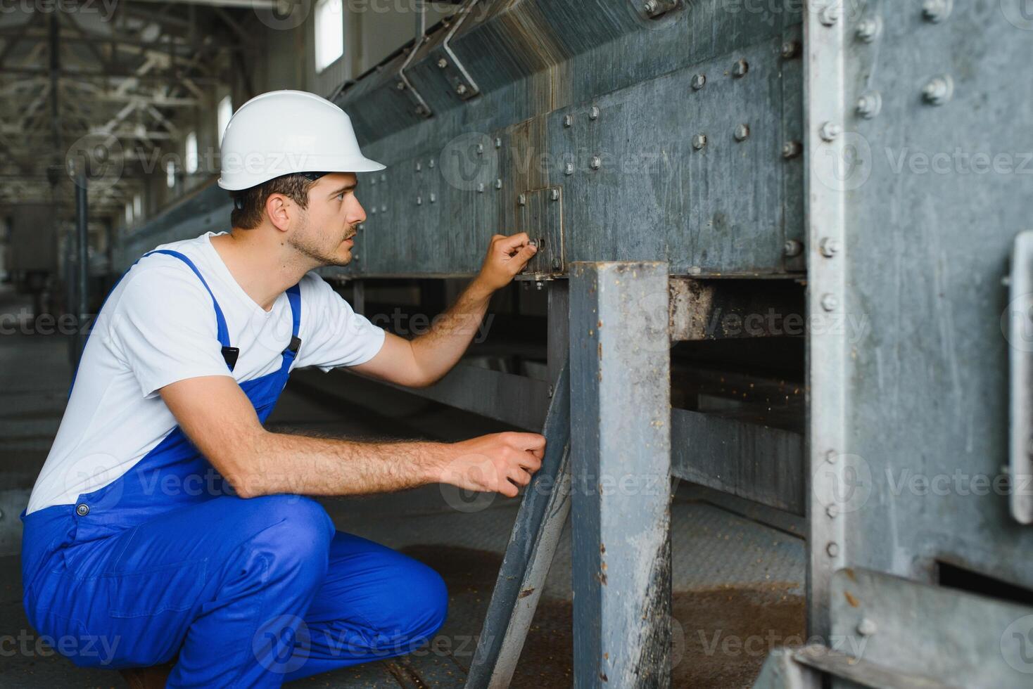 Portrait of factory worker. Young handsome factory worker. photo