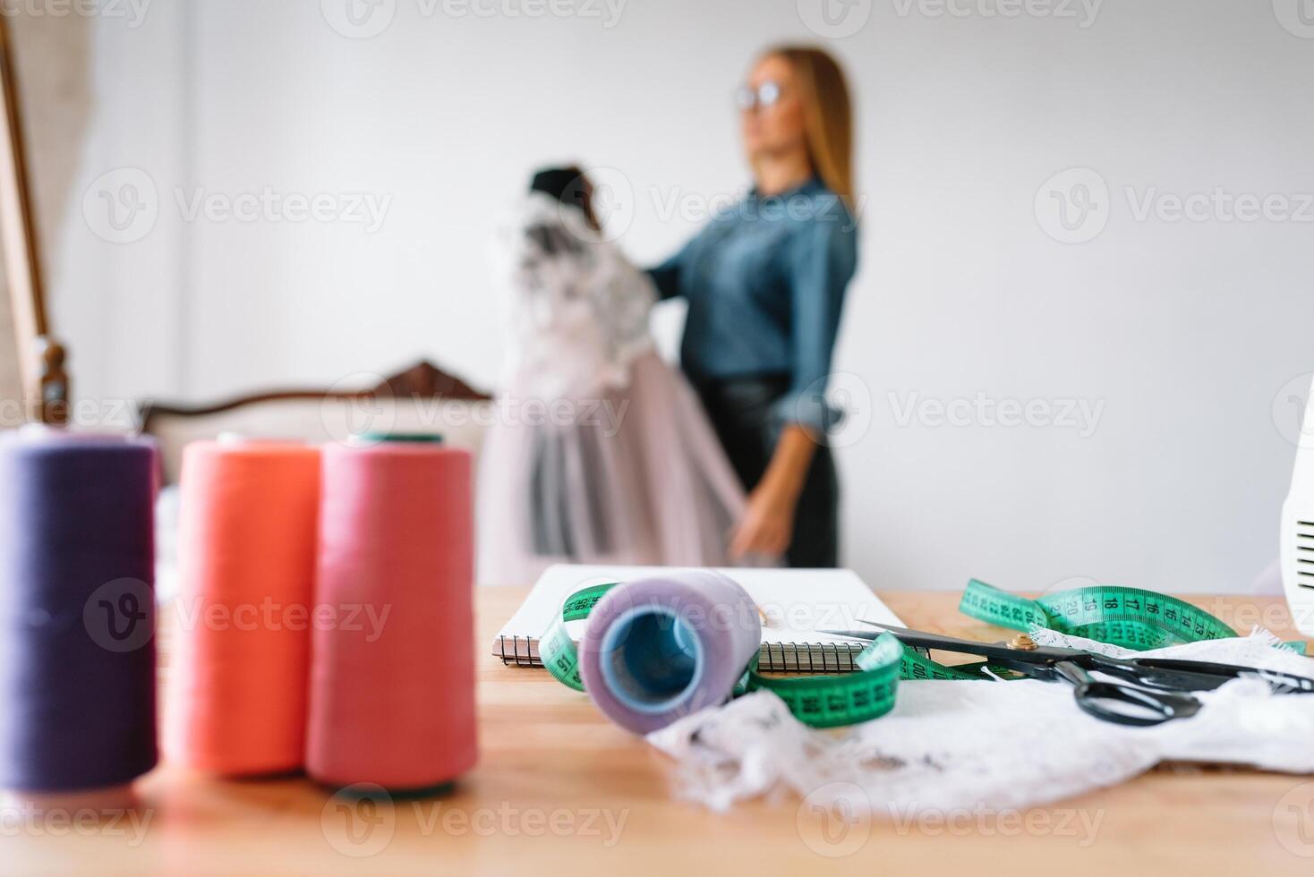 Fashion designer working in the studio photo