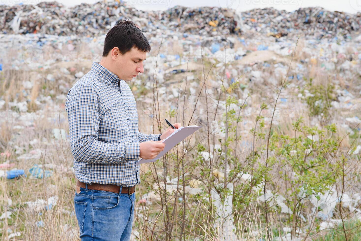 garbage recycling concept. man on dumpster. Keeping the environment clean. Ecological problems. photo