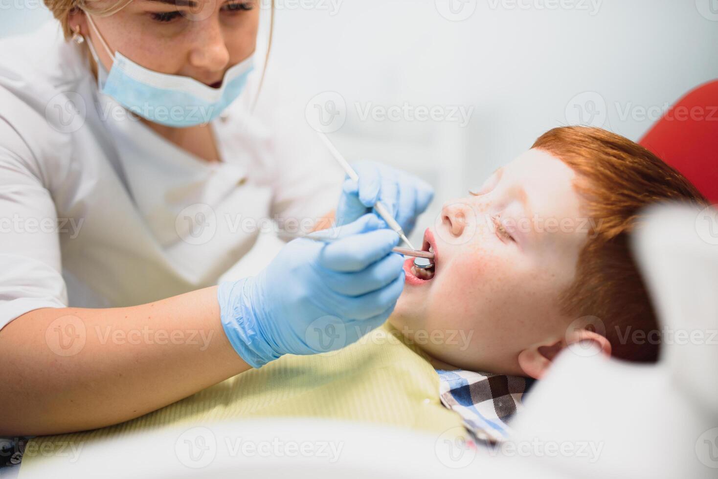 Boy satisfied with the service in the dental office. concept of pediatric dental treatment photo