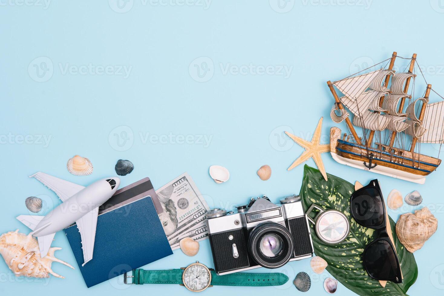 Travel accessories on blue background, travel concept. Top view with copy space photo