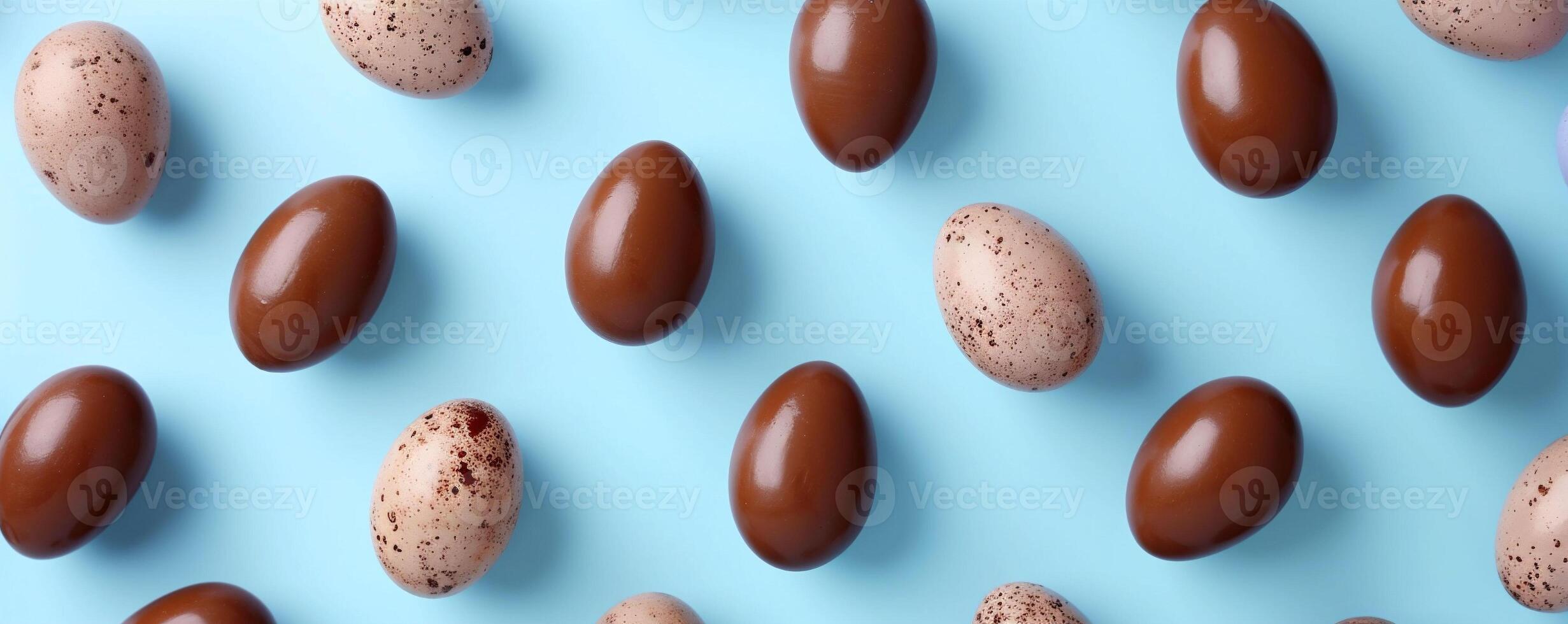 AI generated Assorted chocolate and speckled eggs are arranged on a vibrant blue background, forming a pattern. Wallpaper or background for creative Easter projects or culinary presentations. photo