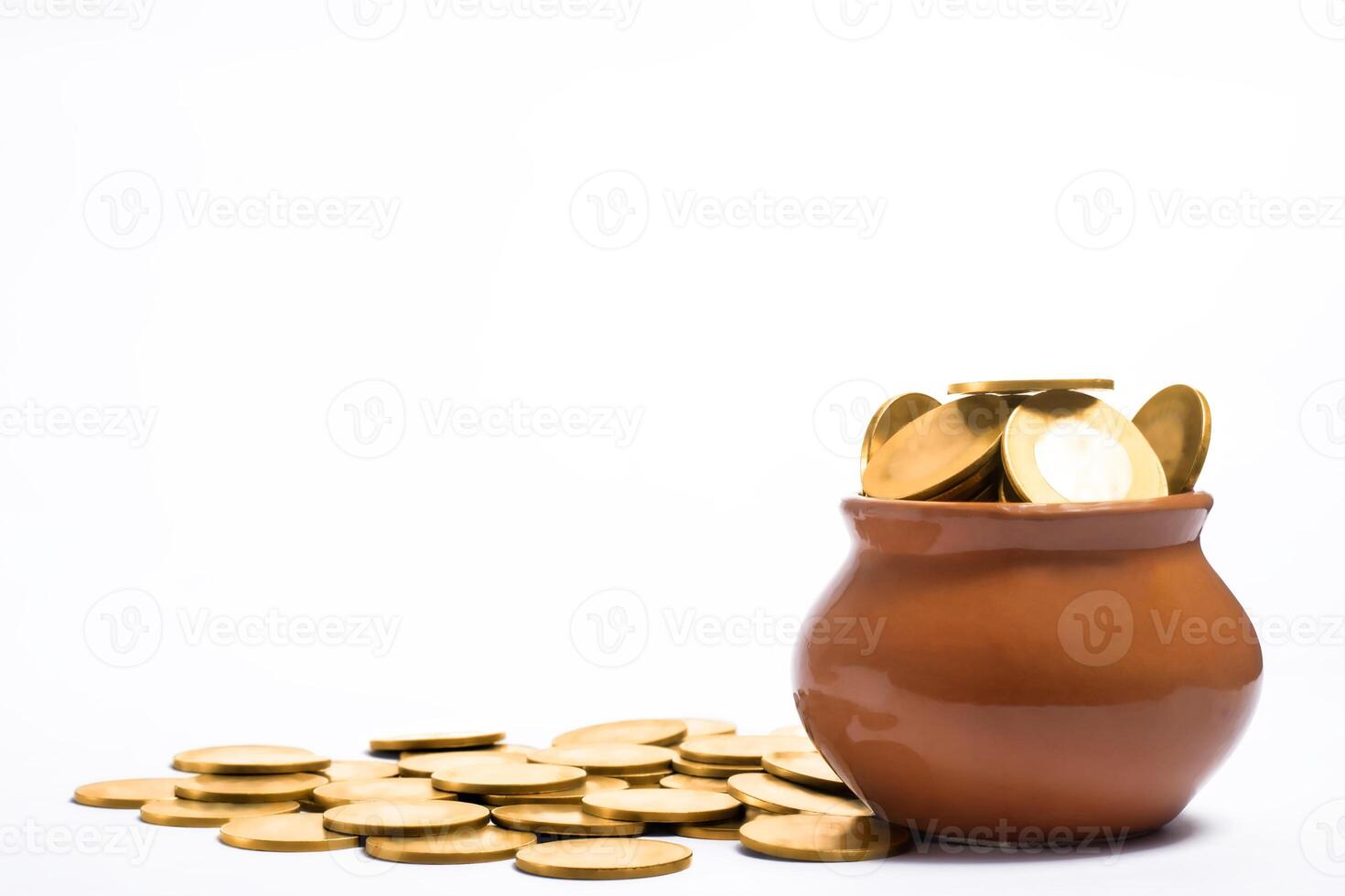 Pot full of gold coins isolated on white background, saving concept. photo