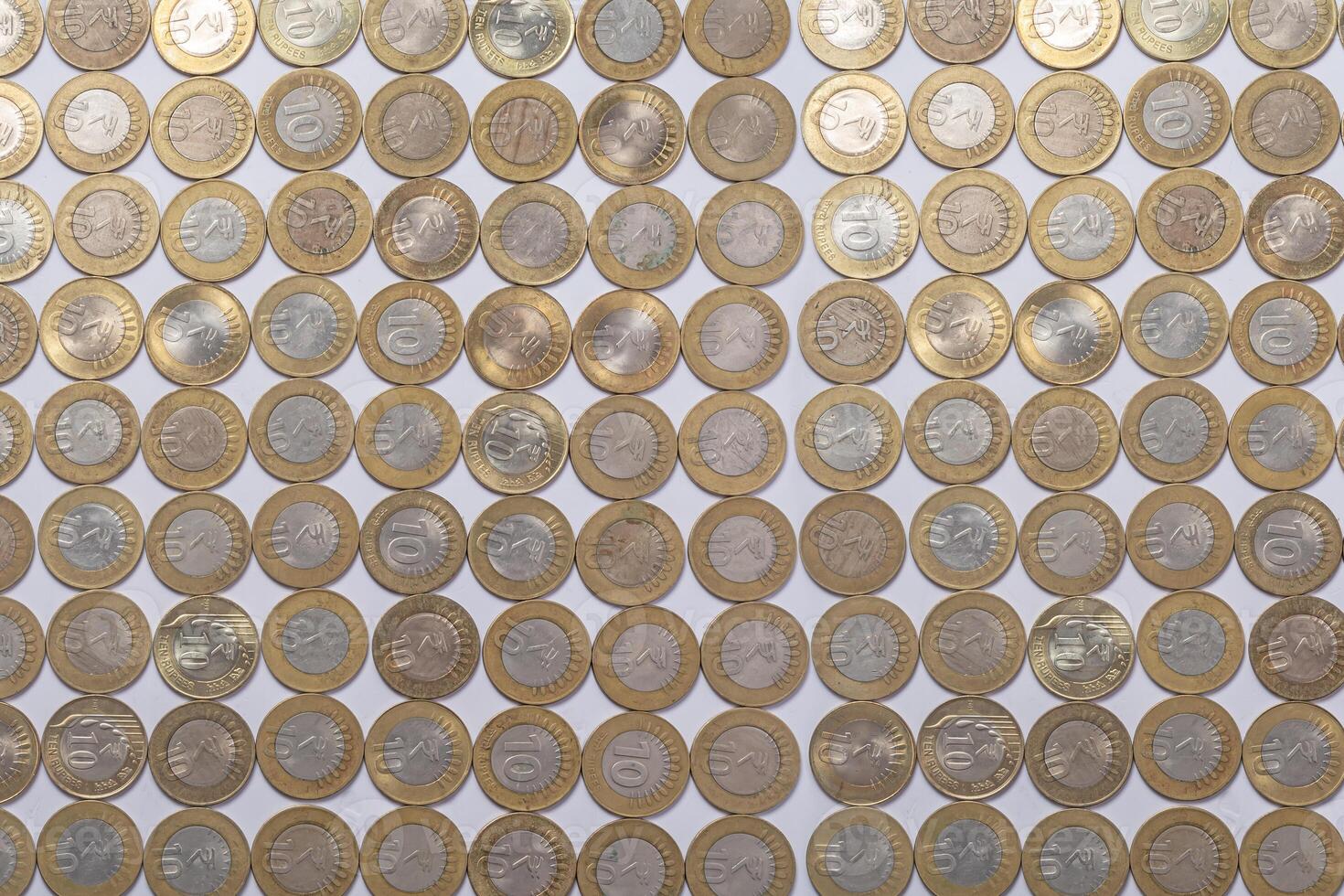 various Indian ten rupee coins background. Top view photo