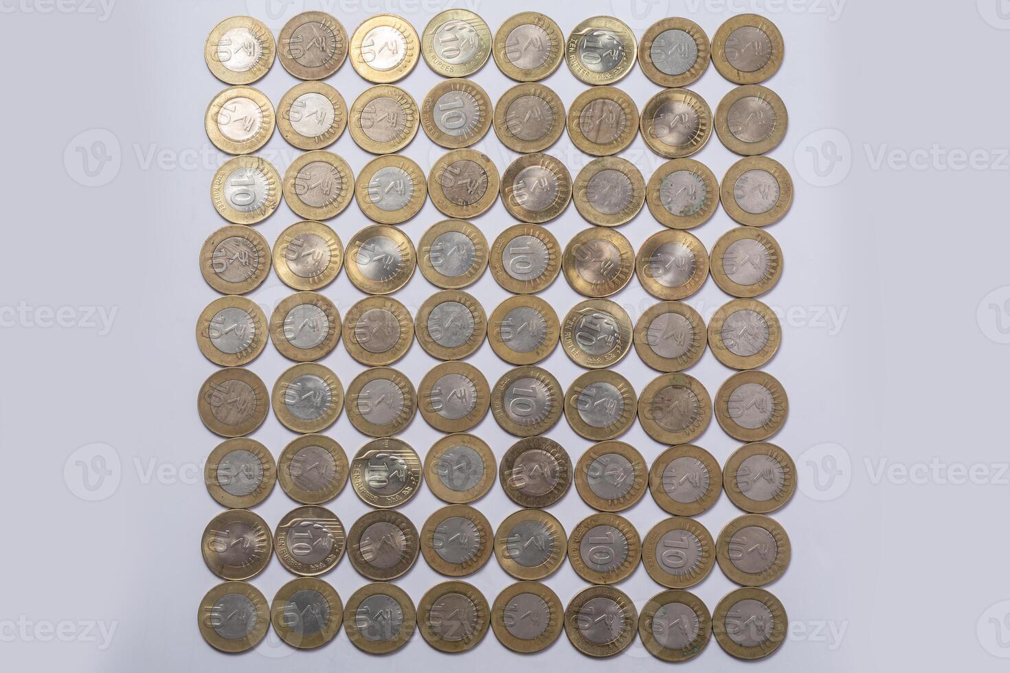 various Indian ten rupee coins background. Top view photo