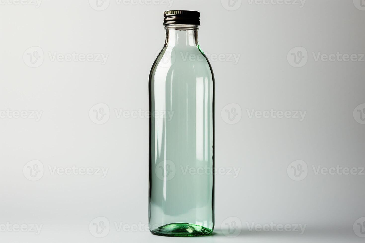 Green glass bottle on a white neutral empty background for product advertising. Copy space photo