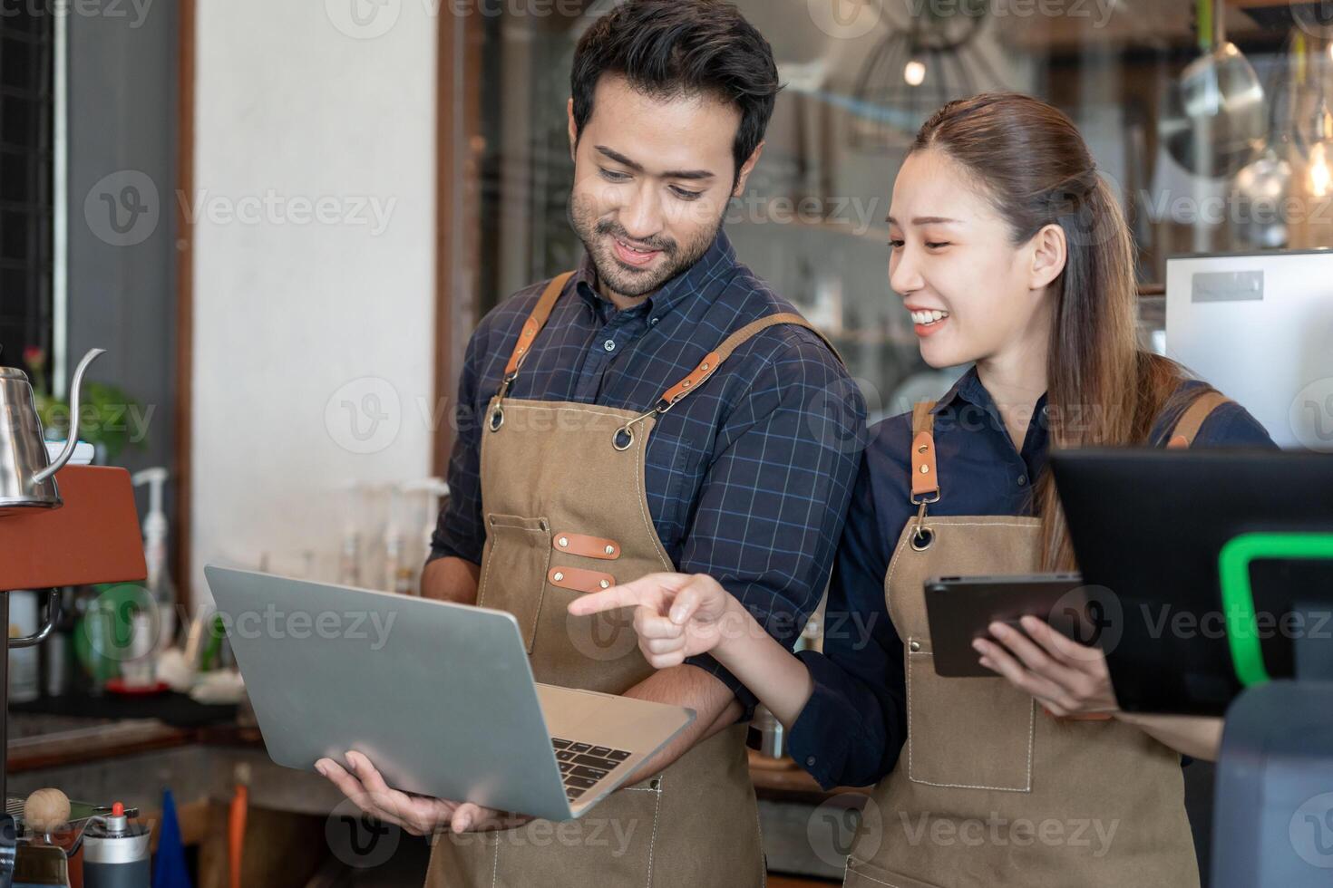 Asia couple owner happy and smile receive order from customer. guarantees safety, cleanliness, open the coffee shop. open for New normal. Small business, welcome, restaurant, home made, cafe photo