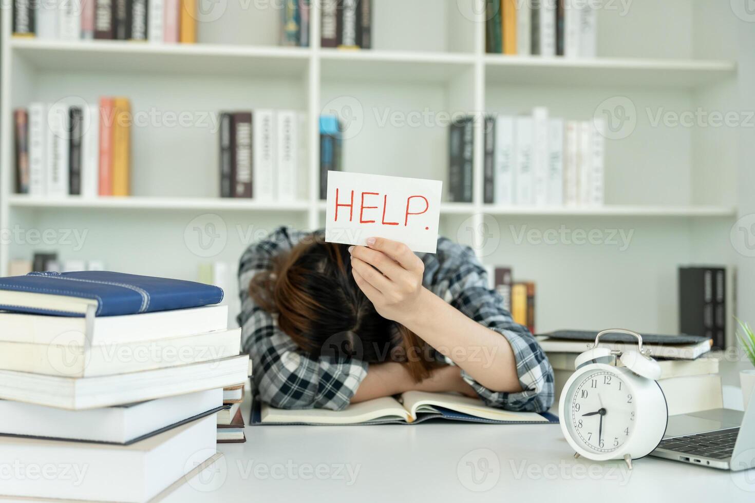 Asian student man have anxiety because of exams, male prepare for test and learning lessons in the library. stress, despair, haste, misunderstanding reading, discouraged, expectation, knowledge, tired photo
