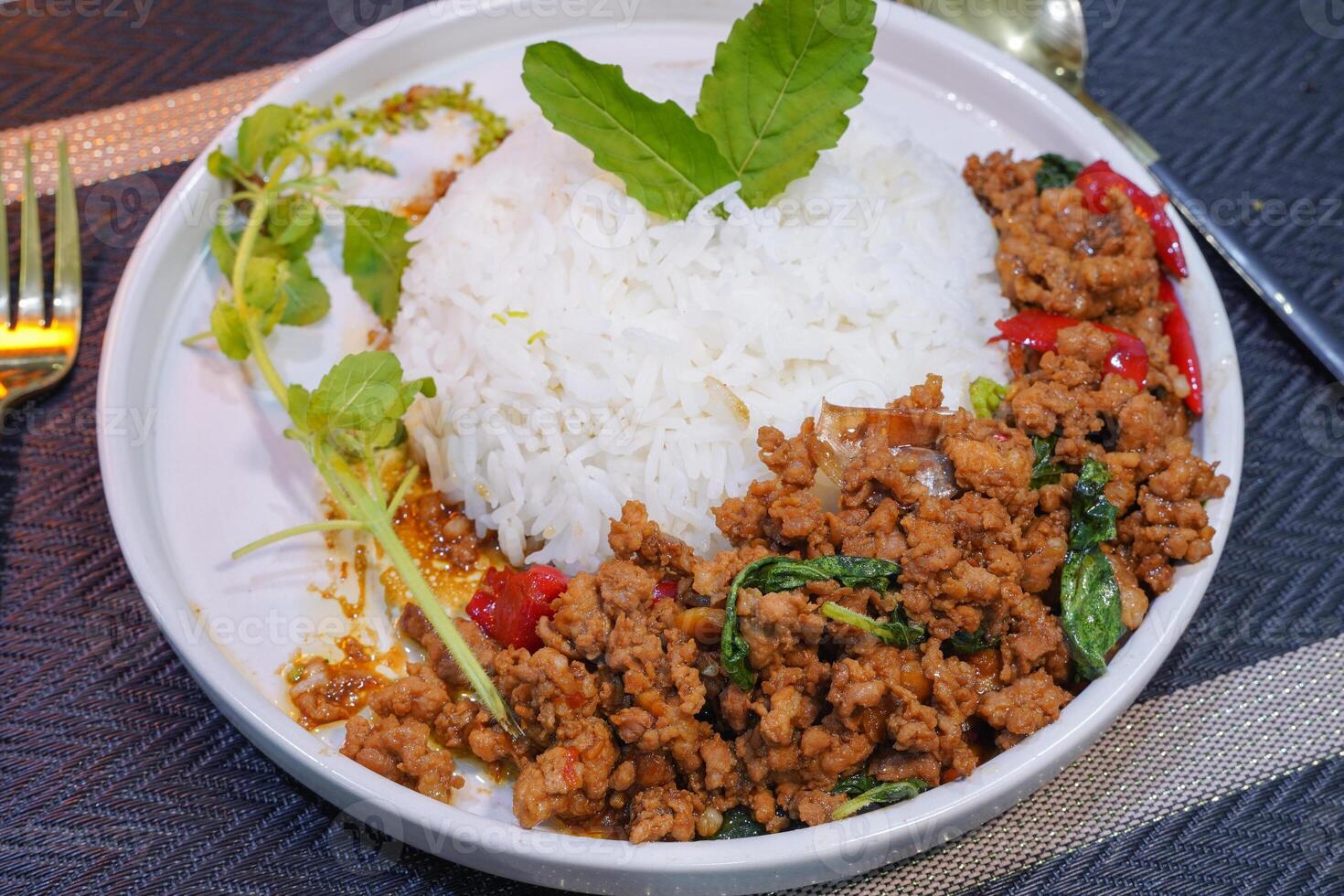 Stir-fried basil with minced pork serving, Famous Thai food photo