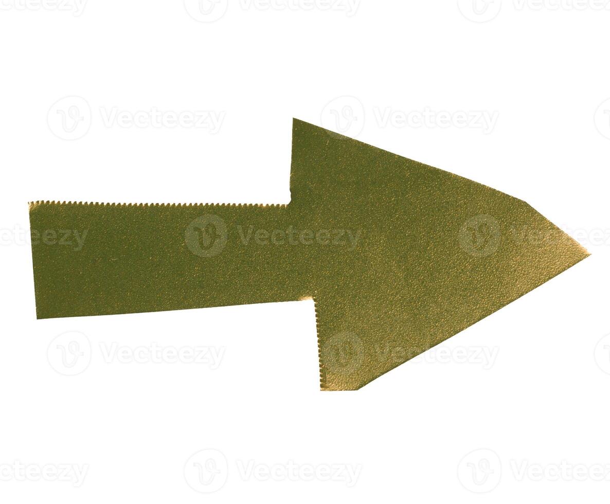Arrow made of yellow shiny cardboard on isolated background photo