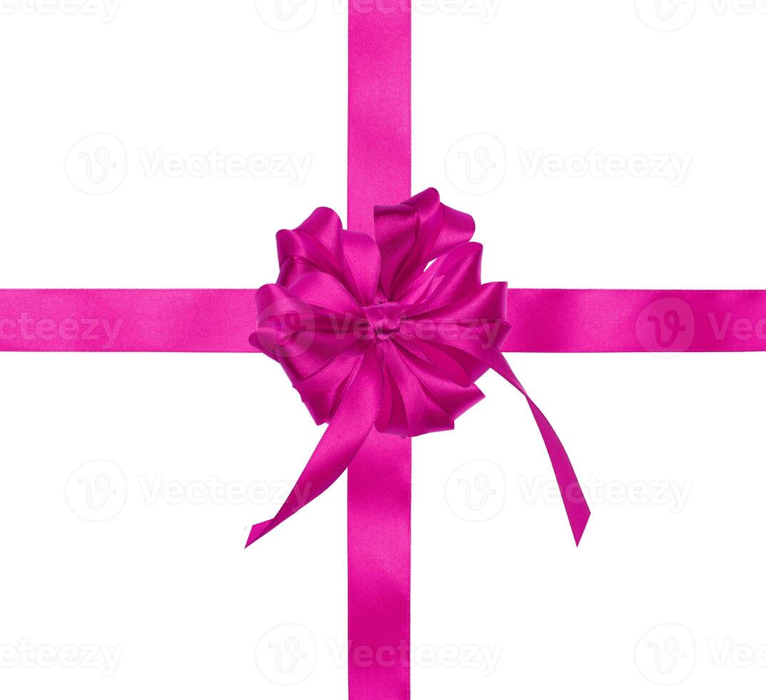 Pink silk ribbon and a tied big bow on an isolated background photo