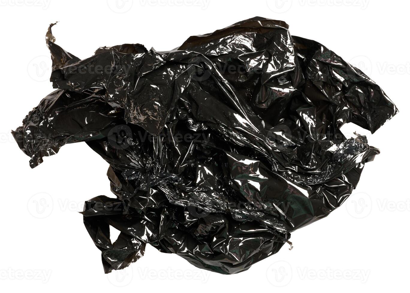 Crumpled piece of black polyethylene on isolated background photo