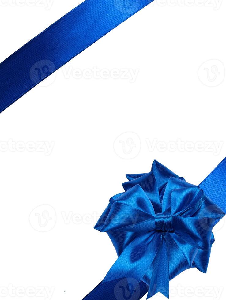 Tied bow made of blue silk ribbon on an isolated background, decor for a gift photo