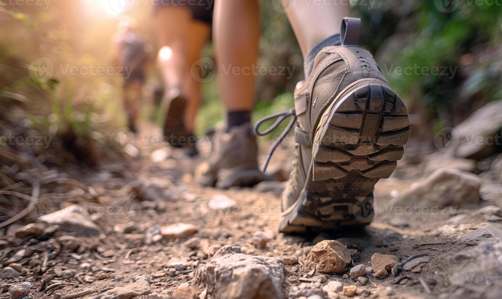 AI generated Hikers walking on a trail in the mountains. Close-up of a pair of hiking shoes photo