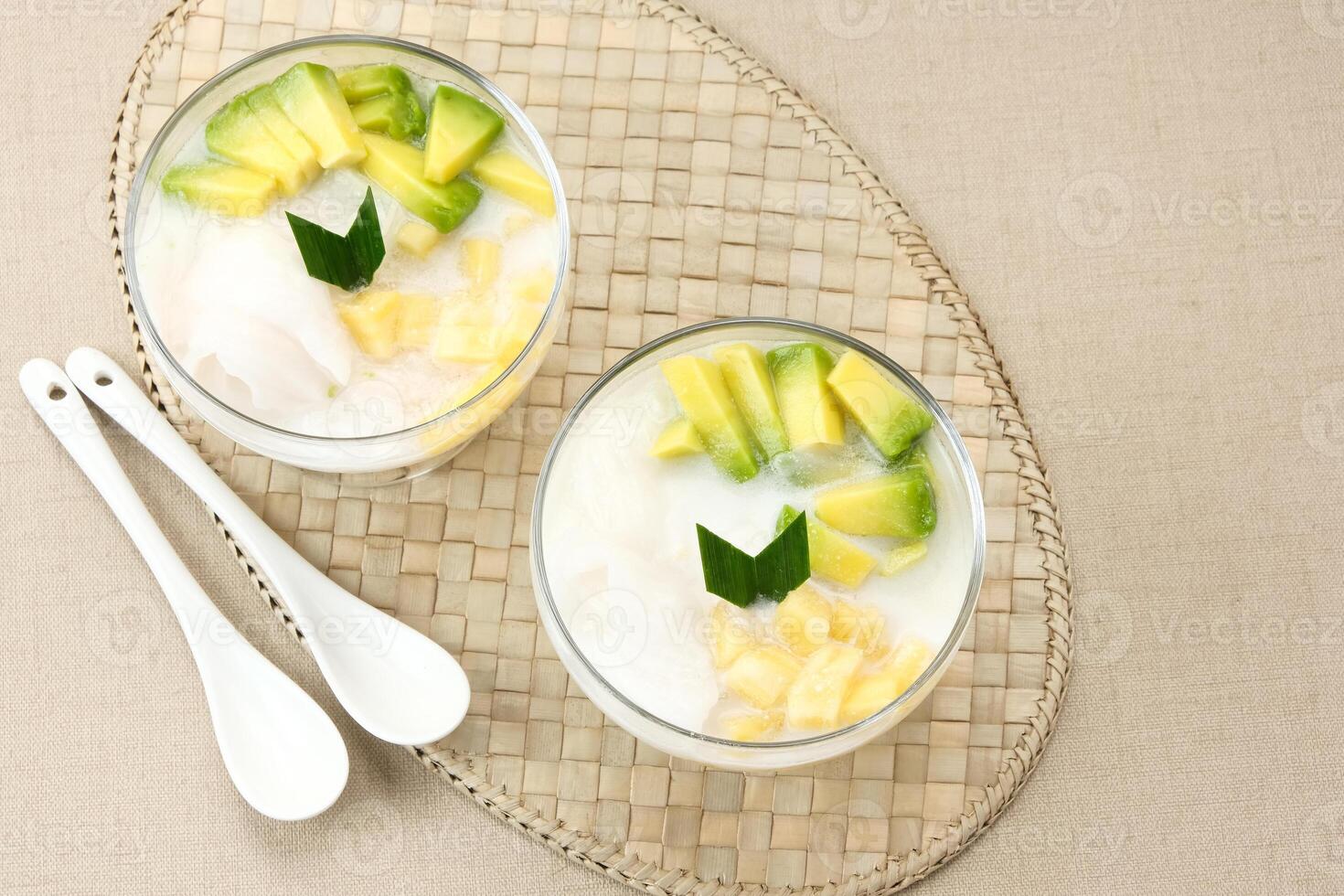 Es teler or es teller, Indonesian dessert, consist of avocado, young coconut, jackfruit, served with coconut milk or sweetened condensed milk. photo