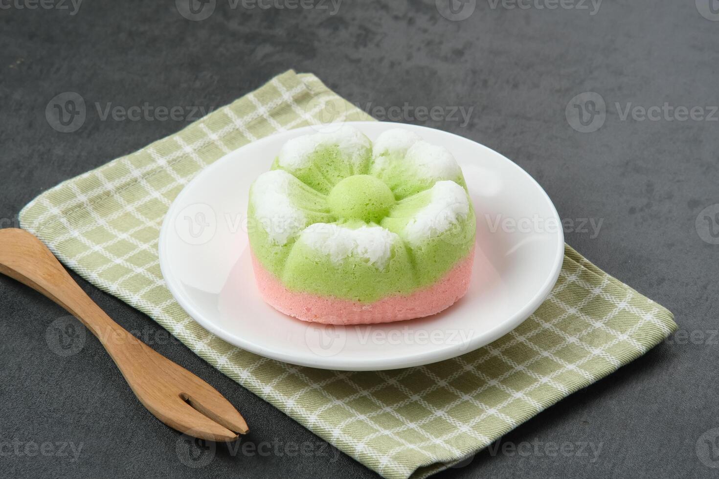 Kue Putu Ayu, a traditional Indonesian snack made from rice flour, suji leaves, pandan leaves, grated coconut then steamed, sweet and savory. photo