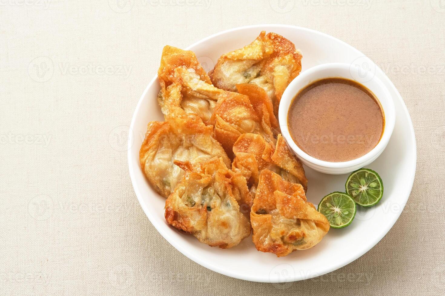 Batagor, made from fish or chicken dumpling, tofu, tapioca flour served with peanut sauce. Indonesian food photo