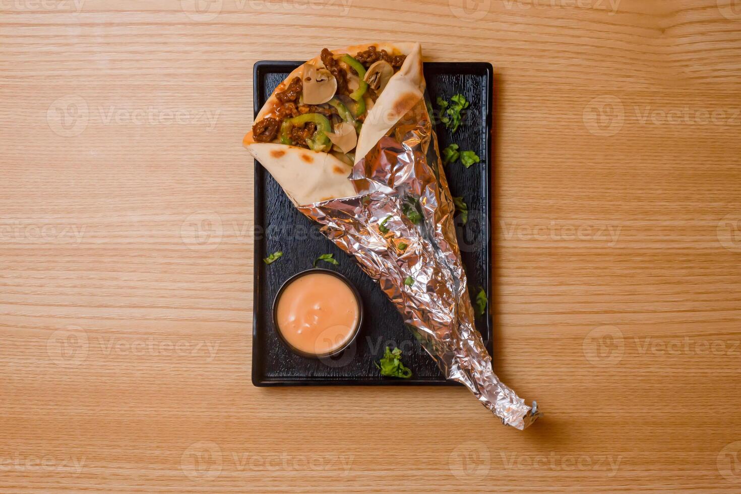 Beef Wrap with dip served in dish isolated on table top view bangladeshi food photo