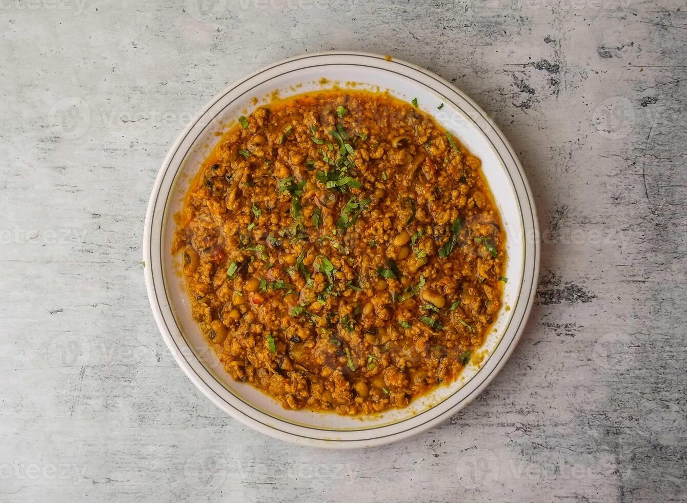 chicken qeema served in a plate isolated on background top view of indian and pakistani desi food photo