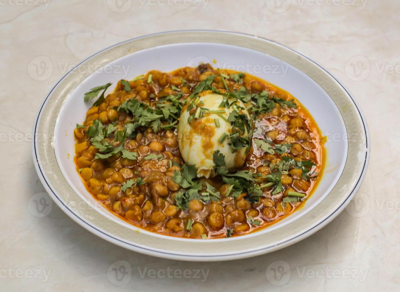 served in plate isolated on table top view of indian and pakistani spicy food photo