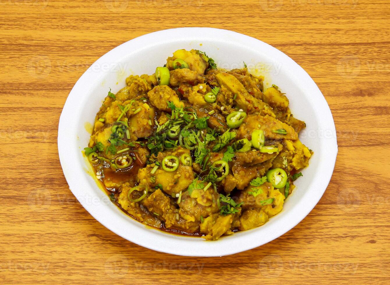 Chicken gobhi gosht served in plate isolated on table top view of indian and pakistani spicy food photo