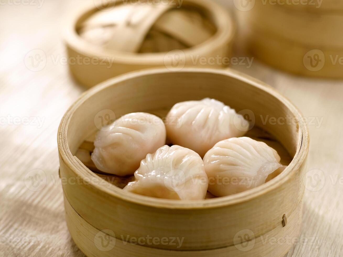 Steamed Prawn Dumpling Ha Kau served in dish isolated on table top view of food photo