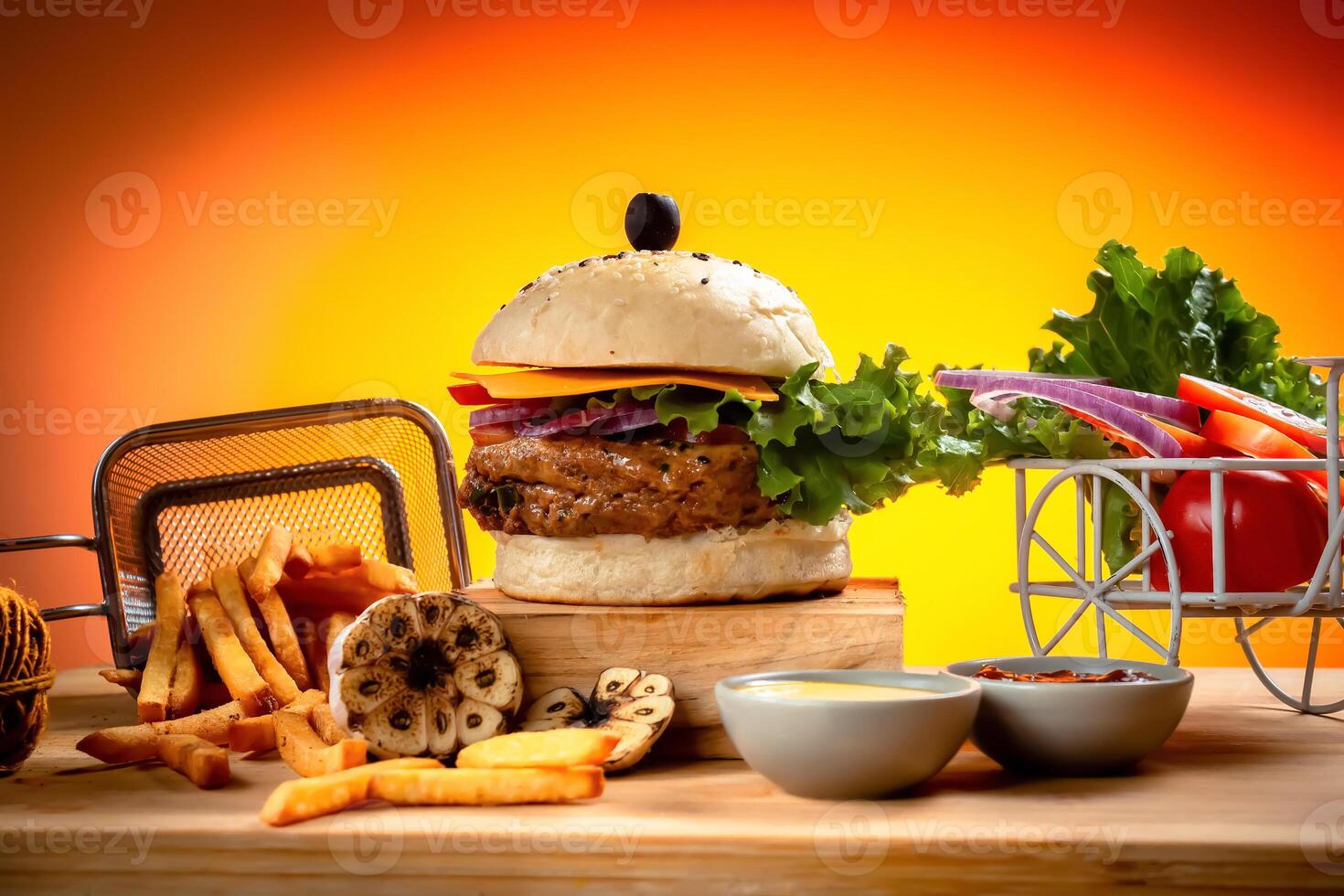 Beef Cheese burger with french fries, potato and tomato slice isolated on wooden board slide view on table fast food photo