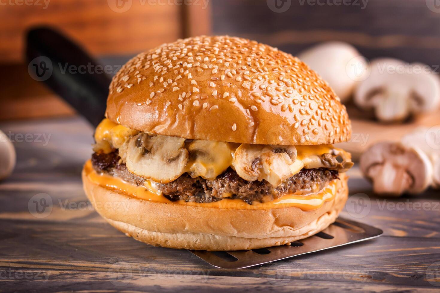 Mushroom Swiss Sandwich isolated on cutting board top view on dark background american fast food photo