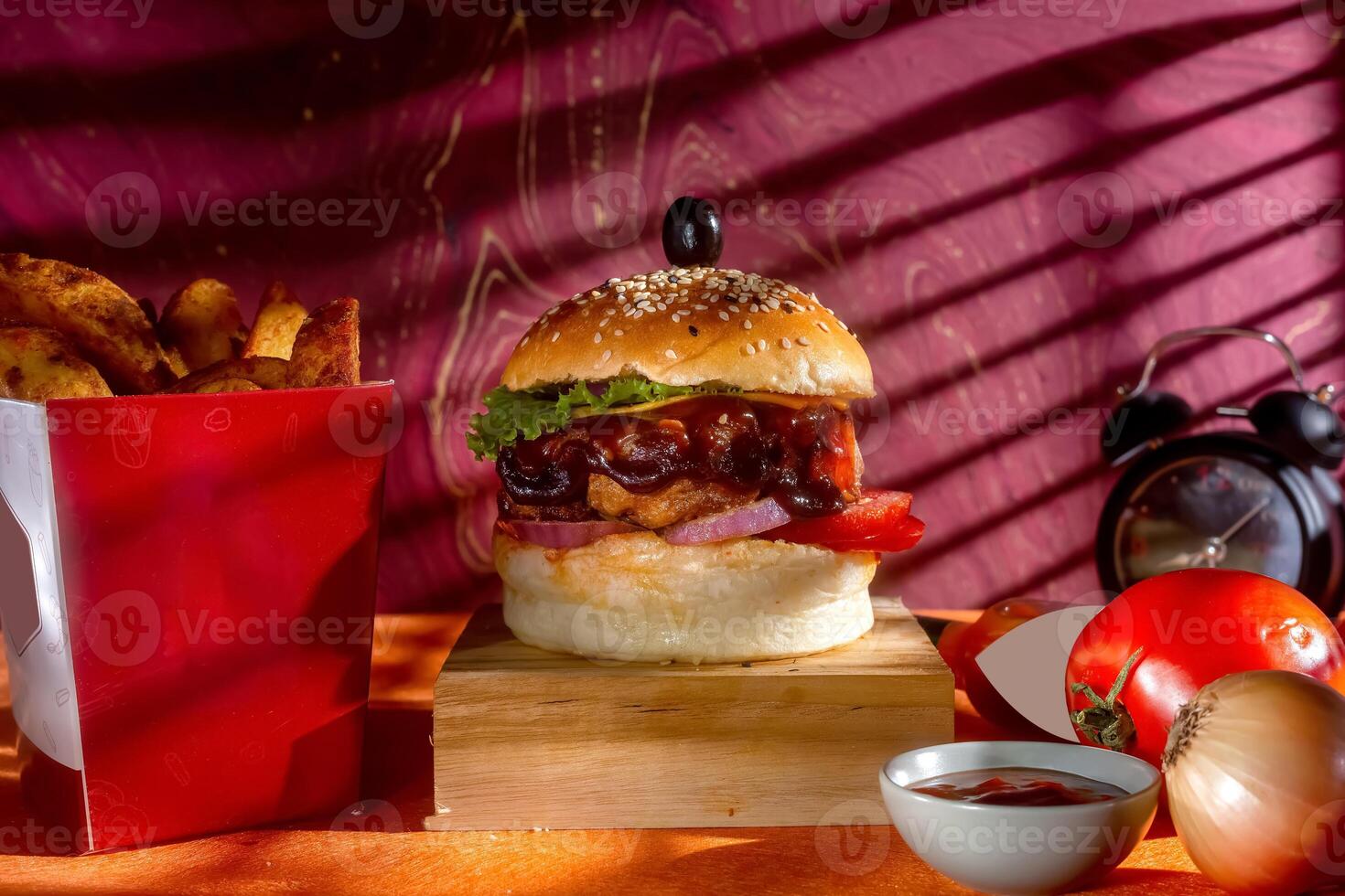 BBQ chicken cheese burger with french fries, potato and tomato slice isolated on wooden board side view on table fast food photo