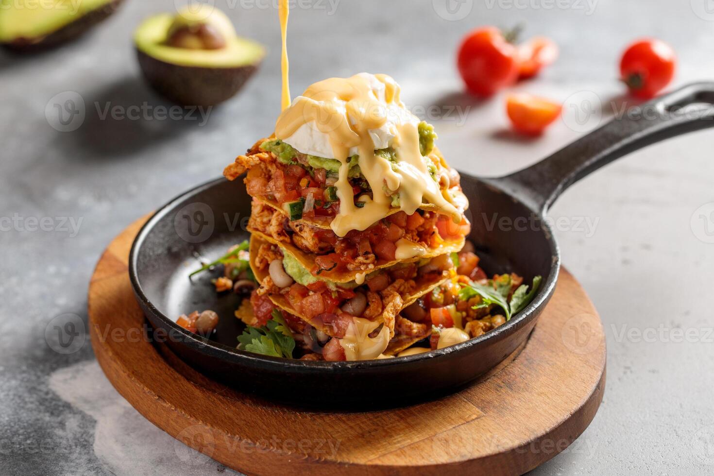 Cheesy tower sandwich served in dish isolated on table top view of arabic breakfast photo