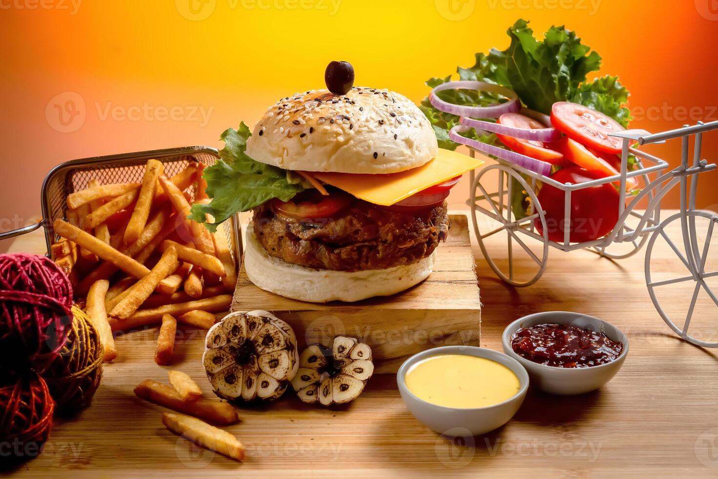 Beef Cheese burger with french fries, potato and tomato slice isolated on wooden board slide view on table fast food photo