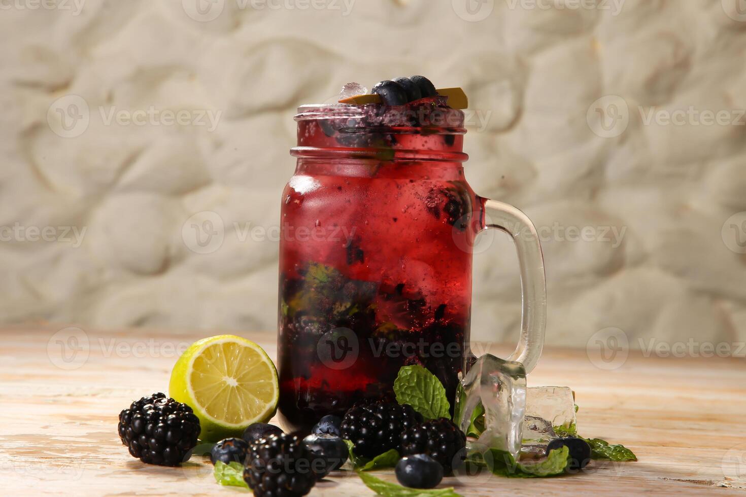 Arabic Style fresh mulberry and raspberry mojito fruit juices served in jar isolated on background top view drink photo