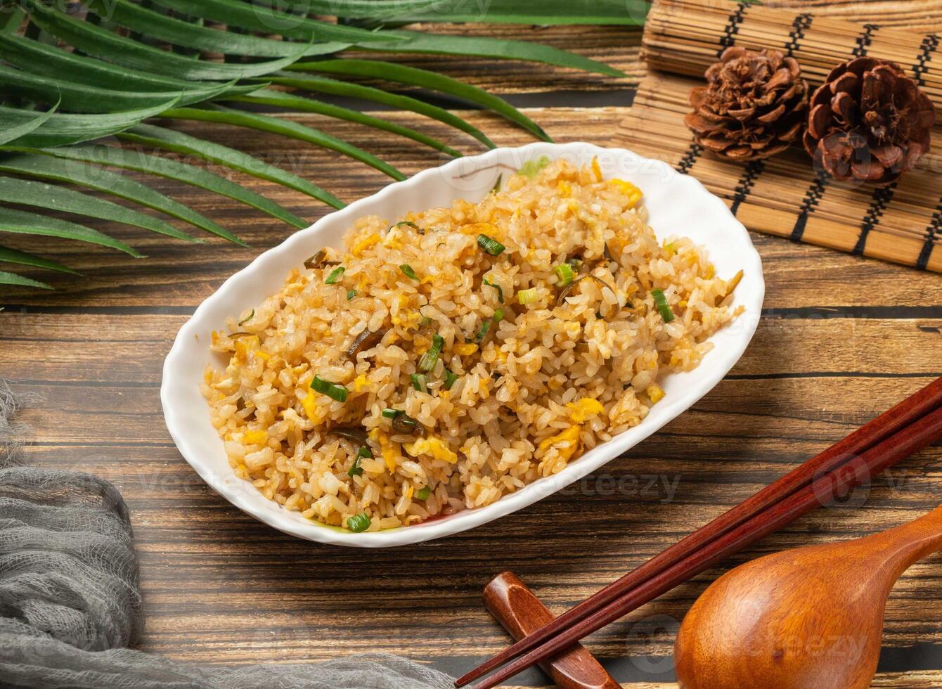 Signature Egg Fried Rice served in bowl isolated on table top view of taiwan food photo