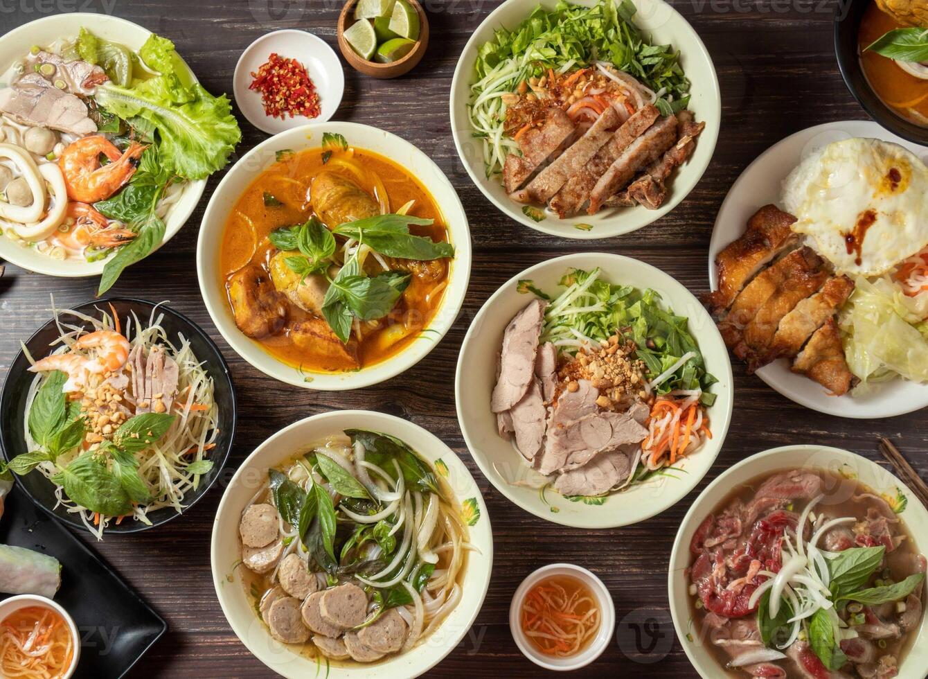 Curry Chicken Hor Fun, Beef Ball Hor Fun, Drumstick Rice, Shredded Papaya, seafood pho, Pork Chops with Vietnamese Rice Noodles, lime and sauce served in bowl isolated on table top view of taiwan food photo