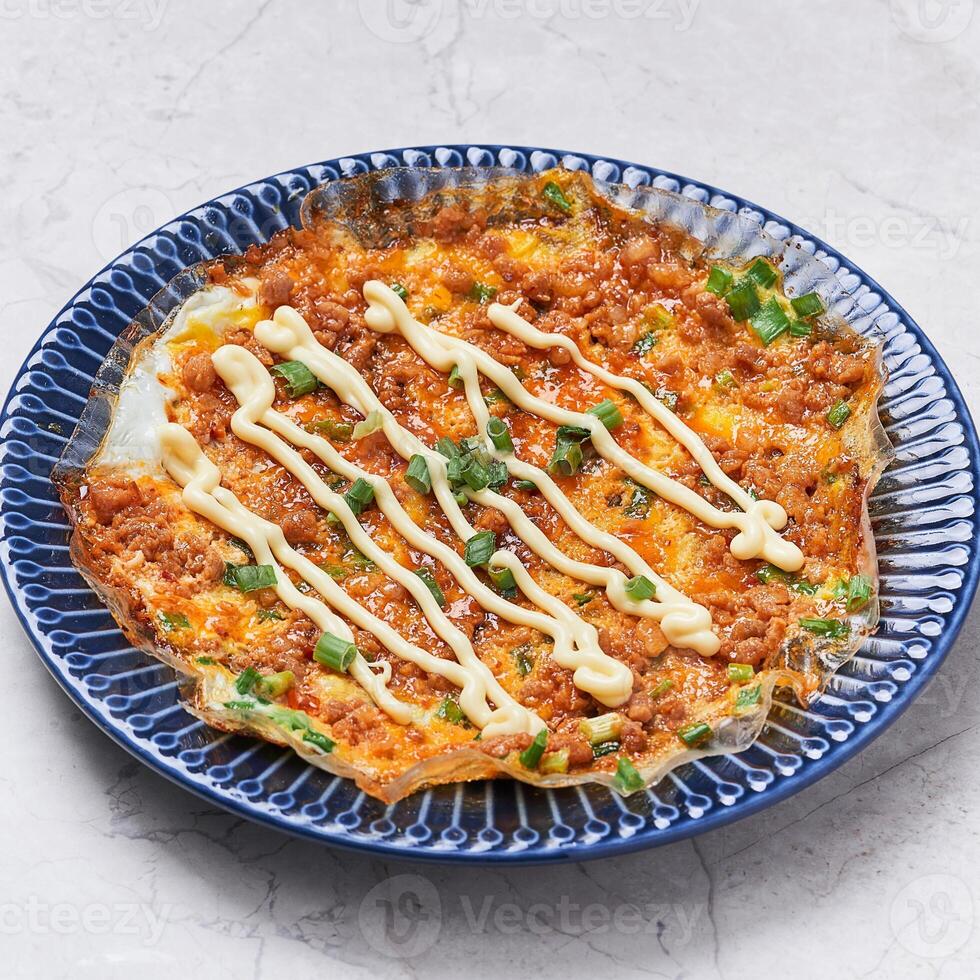 vietnamese pizza served in a dish isolated on grey background side view of vietnam food photo