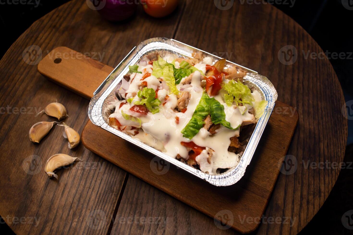Pizza Loaded Fries topping with mayo and chilli sauce served in dish isolated on wooden board top view of italian fastfood spices snack photo