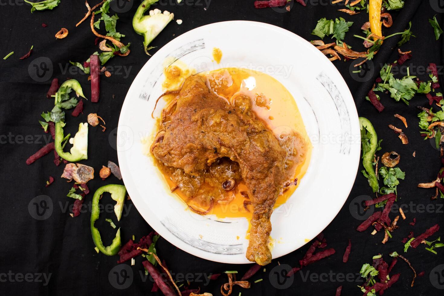 Chicken Roast leg served in dish isolated on dark background top view of indian spices food photo