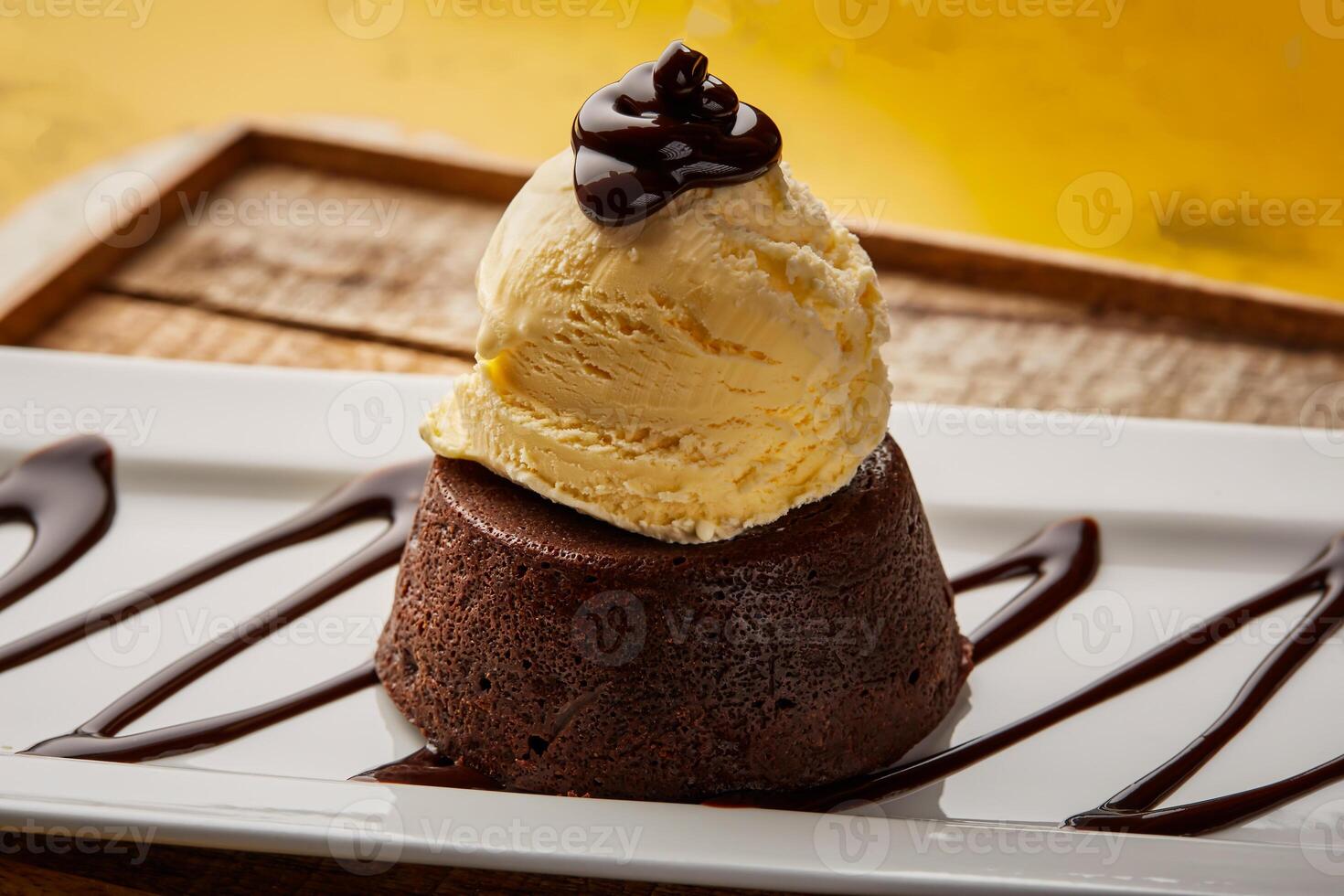 Chocolate Lava Cake served in dish isolated on wooden table top view of arabic sweet dessert photo
