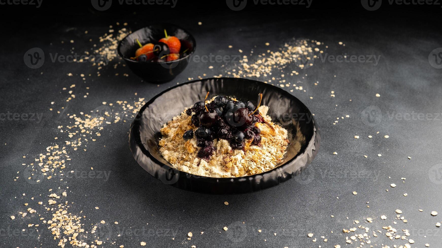 whole grain oatmeal with rapid protein resource and our blackberry special sauce served in dish isolated on table top view of arabic food photo