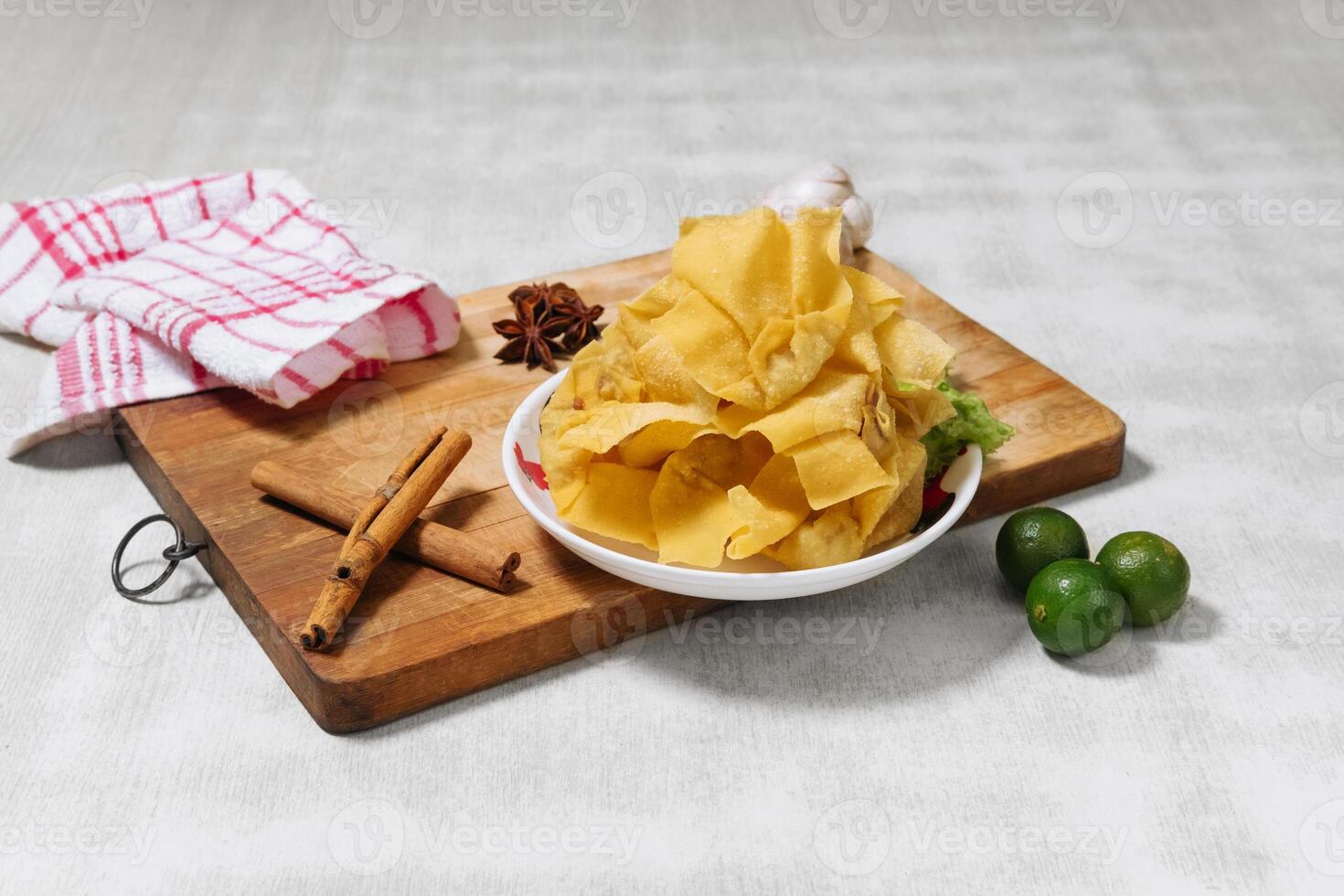 Fried wanton with lemon Chinese food top view on wooden cutting board photo