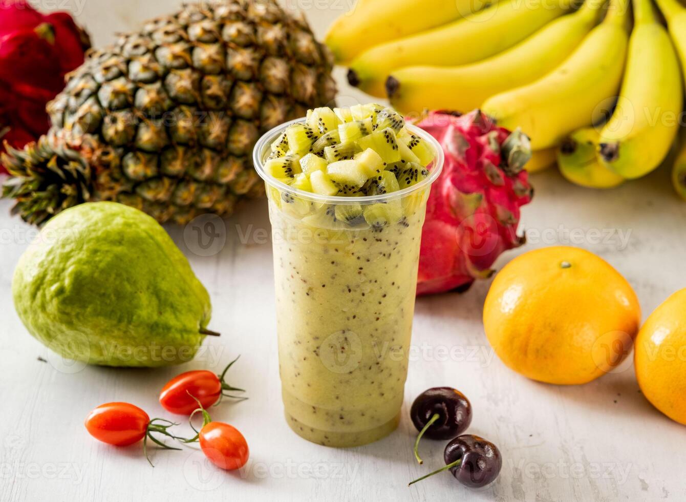 Kiwi juice served in disposable glass isolated on background top view taiwan food photo