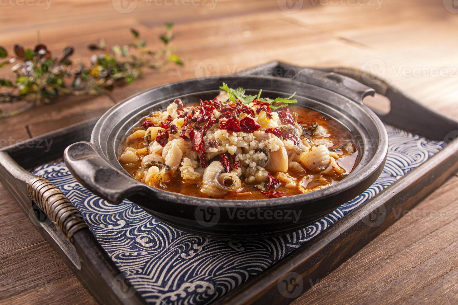 Spicy Chilli Boneless Boiled Fish served dish isolated on wooden table top view of Hong Kong food photo