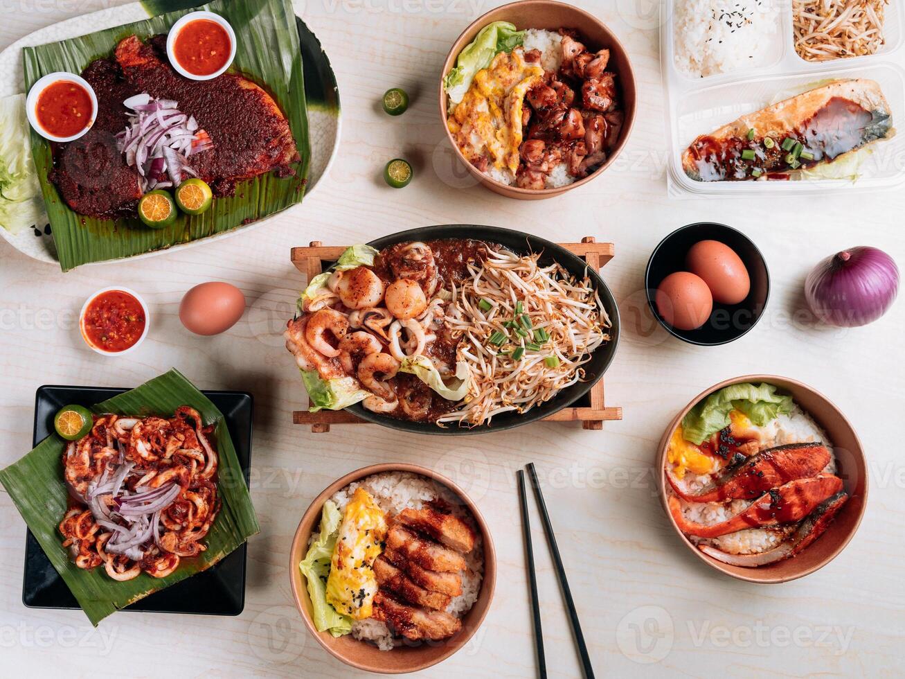 Chinese seafood full table Ebi Fry Set, Chicken Don, BBQ Squid, Katsu Don, Saba Fish Set, Salmon Don, Sliced Lamb Set and Squid Set top view photo