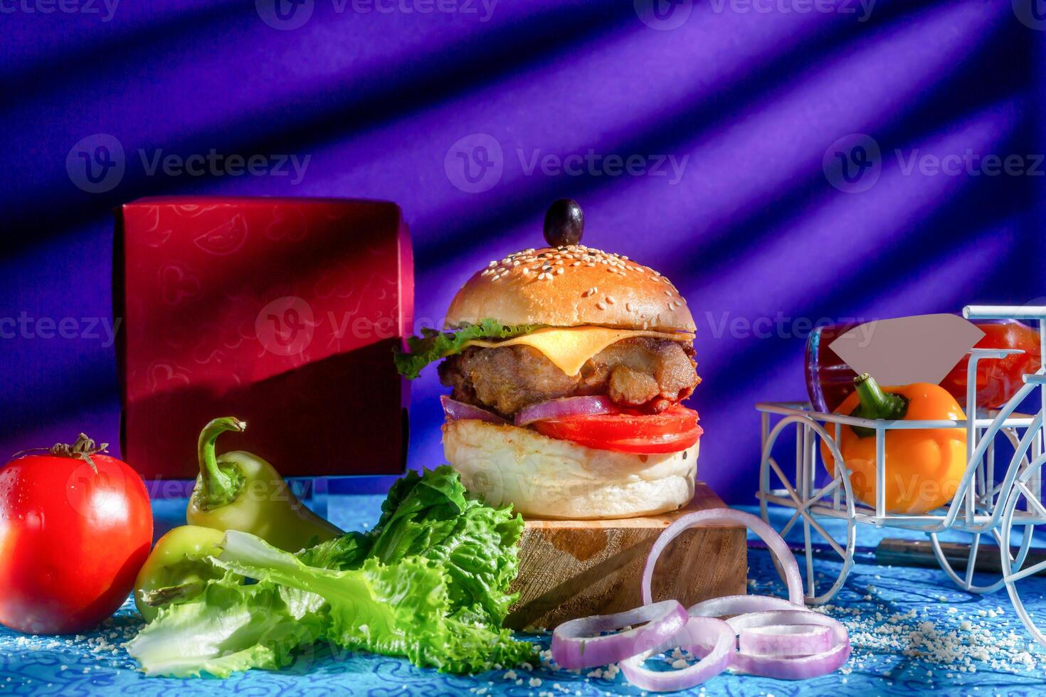 Chicken Cheese Burger with tomato, ketchup and green chilli isolated on wooden board side view of american fast food photo