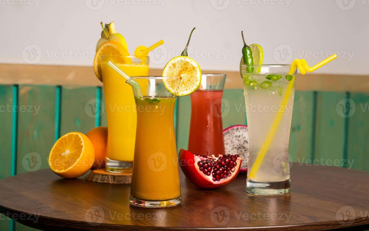 Assorted juices soda, cumin seeds water, watermelon juice shake with Spicy Lemonade, raw watermelon, straw isolated on wooden table side view healthy drink for vitamin c photo